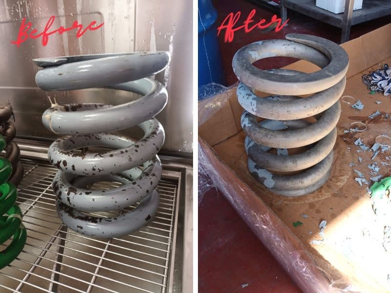 Removing paint and rust from railway bogie springs